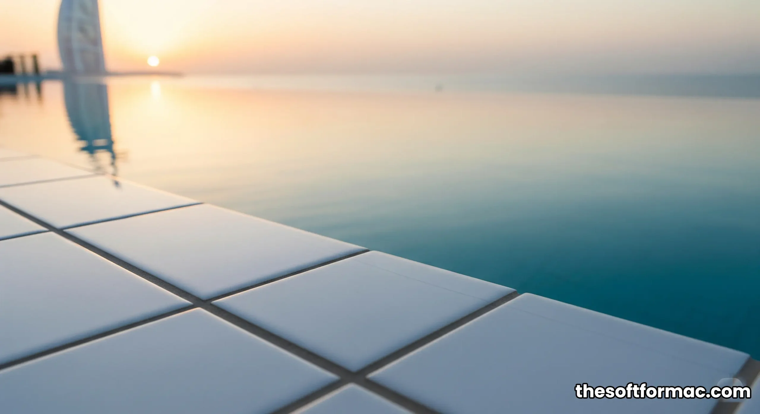 Sweeping aerial view of the Burj Al Arab Terrace extending into the blue Arabian Gulf at sunrise.