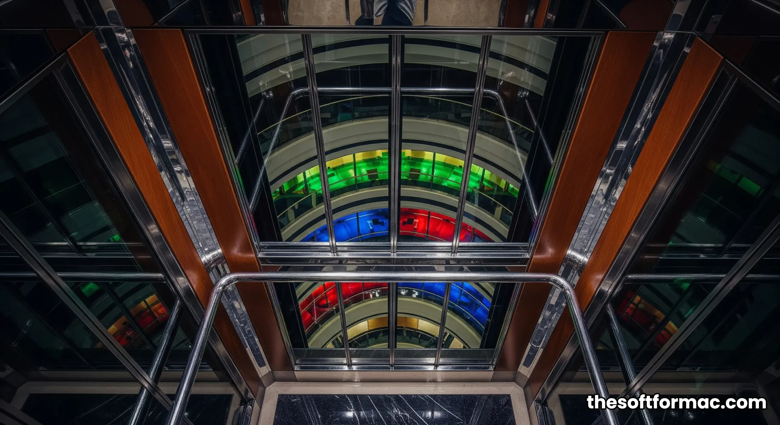 The interior of the express panoramic elevator at the Burj Al Arab hotel, showcasing the futuristic design and view of the grand atrium below.
